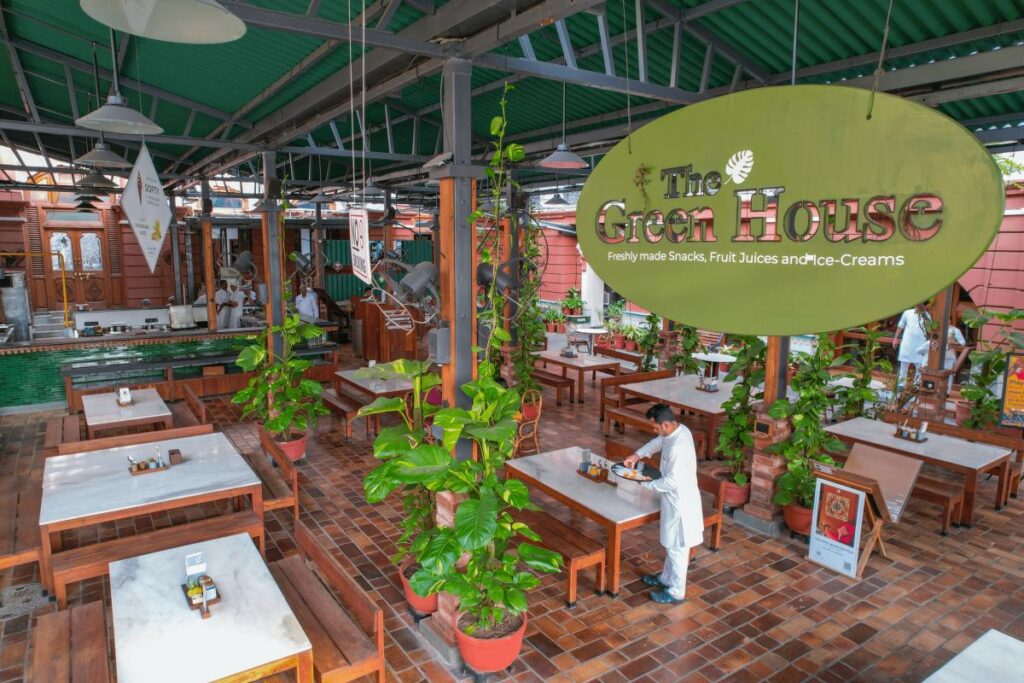 The Green House heritage café surrounded by greenery within The House of MG in Ahmedabad