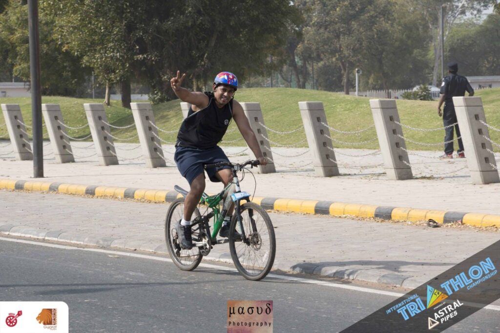 Deepak Agrawal cycling during endurance training as part of his journey to becoming an Ironman and Super Randonneur.