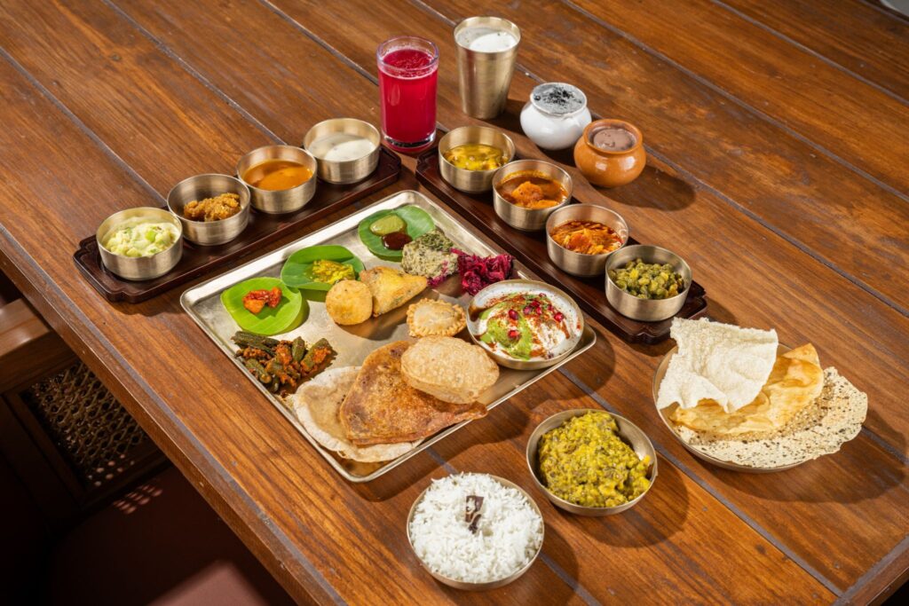 Gujarati thali served by Ananda at Dada Nu Farm in Thaltej, Ahmedabad